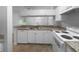 Kitchen with white cabinets, granite countertops, and modern appliances at 2323 Arbor Lakes Cir # 2323, Sanford, FL 32771