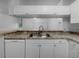 Modern kitchen with stainless steel sink and white cabinetry at 2323 Arbor Lakes Cir # 2323, Sanford, FL 32771
