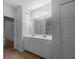 Bathroom with double vanity, tiled floors, and ample storage at 2323 Arbor Lakes Cir # 2323, Sanford, FL 32771