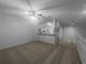 Spacious living room with open floor plan and neutral carpeting at 2323 Arbor Lakes Cir # 2323, Sanford, FL 32771