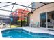 Private screened-in pool with patio furniture at 491 Las Fuentes Dr, Kissimmee, FL 34746