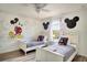 ' bedroom with Mickey Mouse theme and twin beds at 491 Las Fuentes Dr, Kissimmee, FL 34746