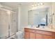 Bathroom with double sinks and a walk-in shower at 491 Las Fuentes Dr, Kissimmee, FL 34746