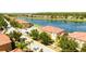 Aerial view of community and lakefront at 491 Las Fuentes Dr, Kissimmee, FL 34746