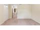 Bedroom with carpet and hallway access at 4032 Mountain Chestnut Way, Lakeland, FL 33812