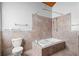 Bathroom with shower/tub combo, tile flooring and walls at 1205 Sutton Trl, Geneva, FL 32732