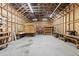 Spacious workshop featuring multiple workbenches and overhead lighting at 1205 Sutton Trl, Geneva, FL 32732