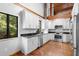 Modern kitchen with white cabinets and granite countertops at 1205 Sutton Trl, Geneva, FL 32732