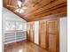 Spacious bedroom closet with built-in shelving and wood floors at 1205 Sutton Trl, Geneva, FL 32732
