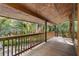 Serene screened porch with wooden floors and American flag at 1205 Sutton Trl, Geneva, FL 32732