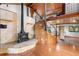 Large living room with a wood burning stove and loft area at 1205 Sutton Trl, Geneva, FL 32732