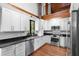 Modern kitchen with white cabinets and granite countertops at 1205 Sutton Trl, Geneva, FL 32732