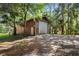 Detached workshop with roll-up door and plenty of space at 1205 Sutton Trl, Geneva, FL 32732