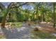 Relaxing backyard oasis with a picnic table and lush landscaping at 1205 Sutton Trl, Geneva, FL 32732