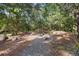 Landscaped garden with rocks and a wooden bench at 1205 Sutton Trl, Geneva, FL 32732