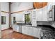 Bright kitchen featuring granite countertops and wood floors at 1205 Sutton Trl, Geneva, FL 32732