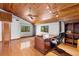 Home office with wood desk, built-in shelving, and hardwood floors at 1205 Sutton Trl, Geneva, FL 32732