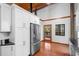 Modern kitchen with stainless steel appliances and white cabinets at 1205 Sutton Trl, Geneva, FL 32732