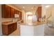 Kitchen with light brown cabinets and breakfast bar at 461 Black Knight Way, Longwood, FL 32779