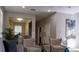 Living room with neutral decor, hardwood floors, and views into the kitchen and dining area at 1002 Calabria Ave, Davenport, FL 33897