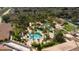 Aerial view of community pool area with surrounding buildings at 1002 Calabria Ave, Davenport, FL 33897