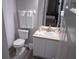 Clean bathroom with a toilet, sink, and shower/tub combo at 1002 Calabria Ave, Davenport, FL 33897