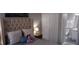 Charming bedroom with a queen-size bed and en-suite bathroom at 1002 Calabria Ave, Davenport, FL 33897
