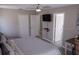 Spacious main bedroom with a king-size bed and access to en-suite bathroom at 1002 Calabria Ave, Davenport, FL 33897