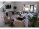 Open living area with hardwood floors, comfortable seating, and access to a screened patio at 1002 Calabria Ave, Davenport, FL 33897