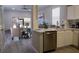 Modern kitchen with stainless steel appliances and an island at 1002 Calabria Ave, Davenport, FL 33897