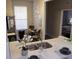 Modern kitchen with a breakfast bar and view into living room at 1002 Calabria Ave, Davenport, FL 33897