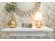Entryway with gold accents and decorative mirror at 1870 Sawyer Palm Pl, Kissimmee, FL 34747