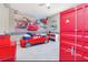 bedroom with Cars themed walls and red truck bed at 1870 Sawyer Palm Pl, Kissimmee, FL 34747