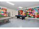 Game room with pool table, ping pong and colorful walls at 1870 Sawyer Palm Pl, Kissimmee, FL 34747