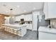 Modern kitchen with white cabinets, quartz countertops, and stainless steel appliances at 1870 Sawyer Palm Pl, Kissimmee, FL 34747