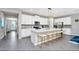 Modern kitchen featuring white cabinets, large island, and stainless steel appliances at 1870 Sawyer Palm Pl, Kissimmee, FL 34747