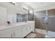 Bathroom with double vanity and large shower at 1870 Sawyer Palm Pl, Kissimmee, FL 34747