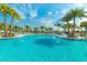 Relaxing community pool with plenty of lounge chairs at 1870 Sawyer Palm Pl, Kissimmee, FL 34747