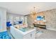 Living room with modern decor, fireplace, and large TV at 1870 Sawyer Palm Pl, Kissimmee, FL 34747