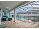 Relaxing pool and spa with covered patio and seating at 1870 Sawyer Palm Pl, Kissimmee, FL 34747