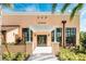Community fitness center with peach exterior, pergola, and landscaping at 1870 Sawyer Palm Pl, Kissimmee, FL 34747
