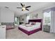 Spacious main bedroom with plush purple bed at 1870 Sawyer Palm Pl, Kissimmee, FL 34747