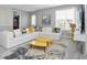 Spacious game room with large sectional sofa and yellow coffee table at 1870 Sawyer Palm Pl, Kissimmee, FL 34747