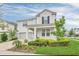 Two story house with landscaping and driveway at 1870 Sawyer Palm Pl, Kissimmee, FL 34747