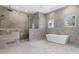 Spa-like bathroom with walk-in shower and soaking tub at 5518 Worsham Ct, Windermere, FL 34786