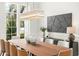 Bright dining room featuring a modern chandelier and a statement wall at 5518 Worsham Ct, Windermere, FL 34786