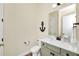 Clean bathroom with vanity, toilet and nautical decor at 8024 Surf St, Kissimmee, FL 34747