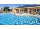 Inviting community pool with solar panels and spa at 17401 Serenidad Blvd, Clermont, FL 34714