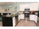Modern kitchen with stainless steel appliances and large island at 17401 Serenidad Blvd, Clermont, FL 34714