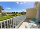 Balcony overlooking a pond, green space, and other townhomes at 17401 Serenidad Blvd, Clermont, FL 34714